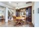 Breakfast nook with built-in cabinetry, round table, and hardwood floors at 14818 Long Iron Dr, Huntersville, NC 28078