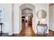 Elegant entryway with hardwood floors, arched doorway, and a decorative console table at 14818 Long Iron Dr, Huntersville, NC 28078