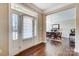 Bright entryway with hardwood floors, white door and view into dining area at 14818 Long Iron Dr, Huntersville, NC 28078