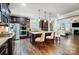 Modern kitchen with stainless steel appliances, granite counters, and hardwood floors at 14818 Long Iron Dr, Huntersville, NC 28078