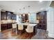 Gourmet kitchen boasts granite island, stainless steel appliances, and rich cabinetry at 14818 Long Iron Dr, Huntersville, NC 28078