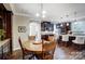 Open kitchen with dark wood cabinets, granite counters, and island seating at 14818 Long Iron Dr, Huntersville, NC 28078