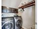 Bright laundry room, featuring modern washer and dryer, and ample storage at 14818 Long Iron Dr, Huntersville, NC 28078