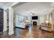 Open living room with hardwood floors and a view into the kitchen area at 14818 Long Iron Dr, Huntersville, NC 28078