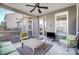 Relaxing screened porch with seating and ceiling fan at 14818 Long Iron Dr, Huntersville, NC 28078