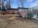 Home features a deck and detached brick garage at 1601 Lyndale Pl, Charlotte, NC 28210