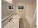 Bathroom with marble vanity and bathtub at 1601 Lyndale Pl, Charlotte, NC 28210