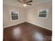 Bedroom with hardwood floors and large windows at 1601 Lyndale Pl, Charlotte, NC 28210