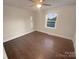 Bright bedroom with hardwood floors and a window offering natural light at 1601 Lyndale Pl, Charlotte, NC 28210