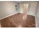 Well-lit bedroom with hardwood floors and access to a bathroom at 1601 Lyndale Pl, Charlotte, NC 28210