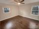 Bright bedroom with hardwood floors and ceiling fan at 1601 Lyndale Pl, Charlotte, NC 28210