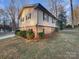 Side view of the house showcasing landscaping at 1601 Lyndale Pl, Charlotte, NC 28210