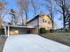 House with carport and mature trees in front at 1601 Lyndale Pl, Charlotte, NC 28210