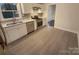 Modern kitchen with white cabinets and stainless steel appliances at 1601 Lyndale Pl, Charlotte, NC 28210