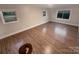 Spacious living room featuring hardwood floors and ample natural light at 1601 Lyndale Pl, Charlotte, NC 28210