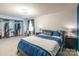 Main bedroom with walk-in closet and blue bedding at 182 Water Oak Dr, Pineville, NC 28134