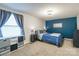 Bright bedroom with a blue comforter and gray nightstands at 182 Water Oak Dr, Pineville, NC 28134