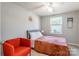 Bedroom with orange accent chair and floral bedding at 182 Water Oak Dr, Pineville, NC 28134