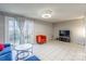 Living room with blue sectional sofa and access to backyard at 182 Water Oak Dr, Pineville, NC 28134