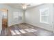 Bright bedroom with wood-look floors and ceiling fan at 210 Lauren Dr, Indian Trail, NC 28079