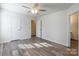 Spacious bedroom with wood-look floors and ceiling fan at 210 Lauren Dr, Indian Trail, NC 28079