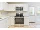 Modern kitchen features stainless steel appliances and white cabinets at 210 Lauren Dr, Indian Trail, NC 28079