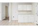 White cabinets and countertops in this kitchen at 210 Lauren Dr, Indian Trail, NC 28079