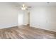 Spacious living room featuring laminate wood floors and a ceiling fan at 210 Lauren Dr, Indian Trail, NC 28079