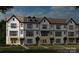 Modern three-story townhouses with white and black exterior at 2306 Donnelly Hills Ln, Charlotte, NC 28262