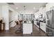 Modern kitchen with island, stainless steel appliances, and dark countertops at 2306 Donnelly Hills Ln, Charlotte, NC 28262