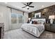 Spacious bedroom with large windows, plush bedding, and dark accents at 2310 Donnelly Hills Ln, Charlotte, NC 28262