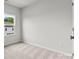 Bright bedroom featuring a window and neutral wall colors at 2314 Donnelly Hills Ln, Charlotte, NC 28262