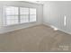 Spacious bedroom with large window and neutral carpet at 2653 Early Flight Dr, Charlotte, NC 28262