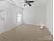 Spacious bedroom with neutral carpeting and large window at 2653 Early Flight Dr, Charlotte, NC 28262