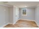 Spacious bedroom with hardwood floors and a large window at 277 Melrose Sw Dr, Concord, NC 28025