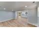 Open concept living room with hardwood floors and an adjacent kitchen at 277 Melrose Sw Dr, Concord, NC 28025