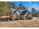 Two-story brick home with a large backyard and mature trees at 305 Goldfinch Ct, Shelby, NC 28150