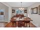 Bright dining area with hardwood floors and a view into the kitchen at 305 Goldfinch Ct, Shelby, NC 28150