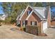 Brick house exterior with a two-car garage and manicured landscaping at 305 Goldfinch Ct, Shelby, NC 28150