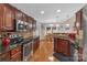 Modern kitchen with stainless steel appliances and granite countertops at 305 Goldfinch Ct, Shelby, NC 28150