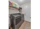 Laundry room with washer, dryer, and shelving at 305 Goldfinch Ct, Shelby, NC 28150