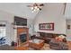 Spacious living room with vaulted ceiling, fireplace, and large sectional sofa at 305 Goldfinch Ct, Shelby, NC 28150