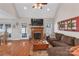 Open living area with hardwood floors, a fireplace, and access to the backyard at 305 Goldfinch Ct, Shelby, NC 28150