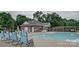 Community pool with lounge chairs and adjacent building at 305 Goldfinch Ct, Shelby, NC 28150