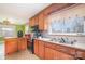 Close-up of a kitchen with a large window and stainless steel appliances at 3050 Wilkesboro Hwy, Statesville, NC 28625