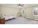 Cozy bedroom featuring plush carpeting, natural light and neutral paint, ideal for relaxation at 330 Regency Rd, Salisbury, NC 28147