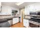 L-shaped kitchen with granite countertops and stainless steel appliances at 330 Regency Rd, Salisbury, NC 28147