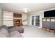 Living room with brick fireplace and built-in shelving at 330 Regency Rd, Salisbury, NC 28147