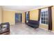 Inviting living room with tile floors, a modern sofa, and natural light from large windows at 330 Regency Rd, Salisbury, NC 28147