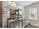 Bathroom with double vanity, marble countertop, and large mirror at 3319 Holt St, Charlotte, NC 28205